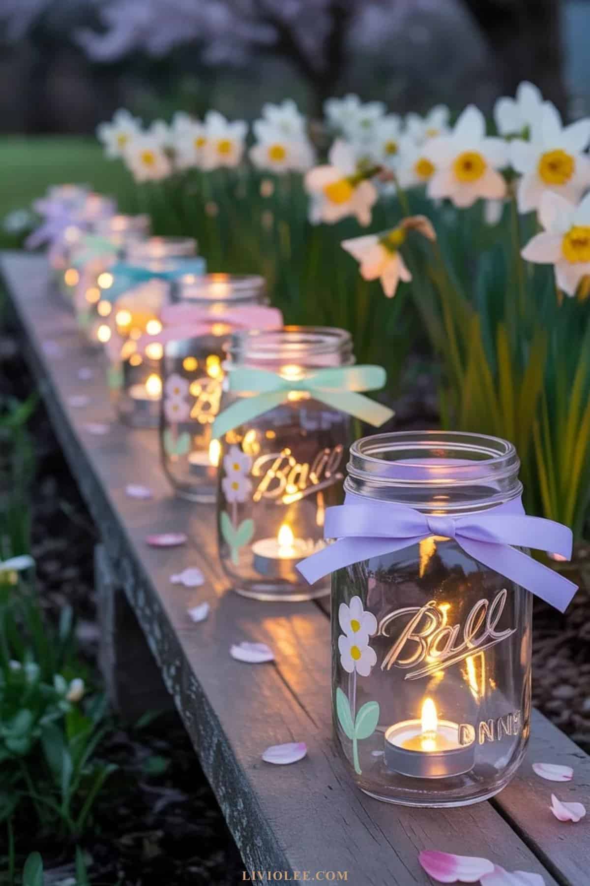 mason jar luminaries glowing with candles during spring evening