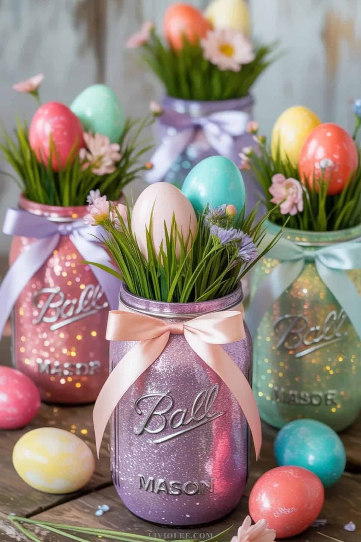 glitter mason jar Easter decoration filled with pastel eggs and spring flowers