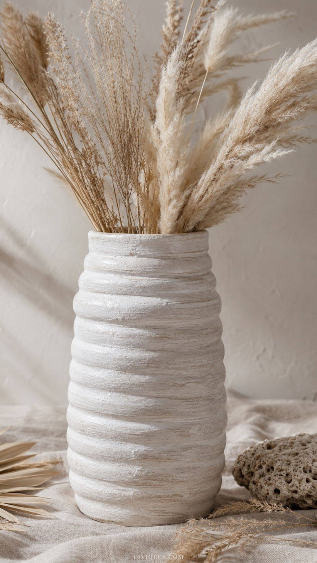 handmade air dry clay coil-built bottle vase with a whitewashed finish and visible textured ridges