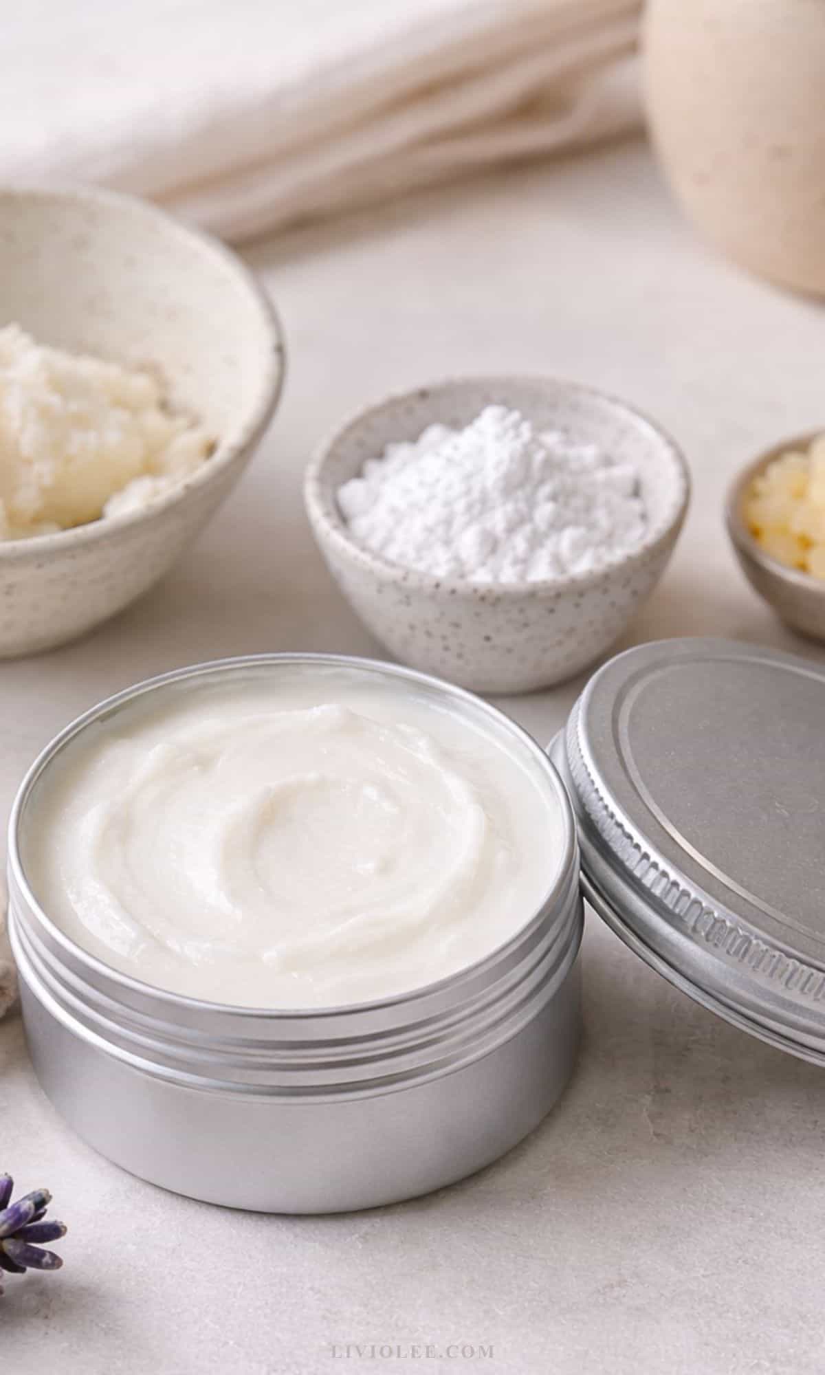 DIY beef tallow sunscreen recipe in metal tins with creamy white texture and zinc oxide blend