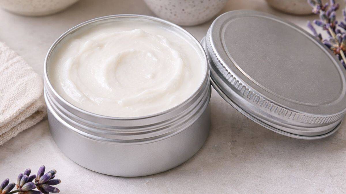 Homemade beef tallow sunscreen in round tins with smooth white balm and natural skincare styling