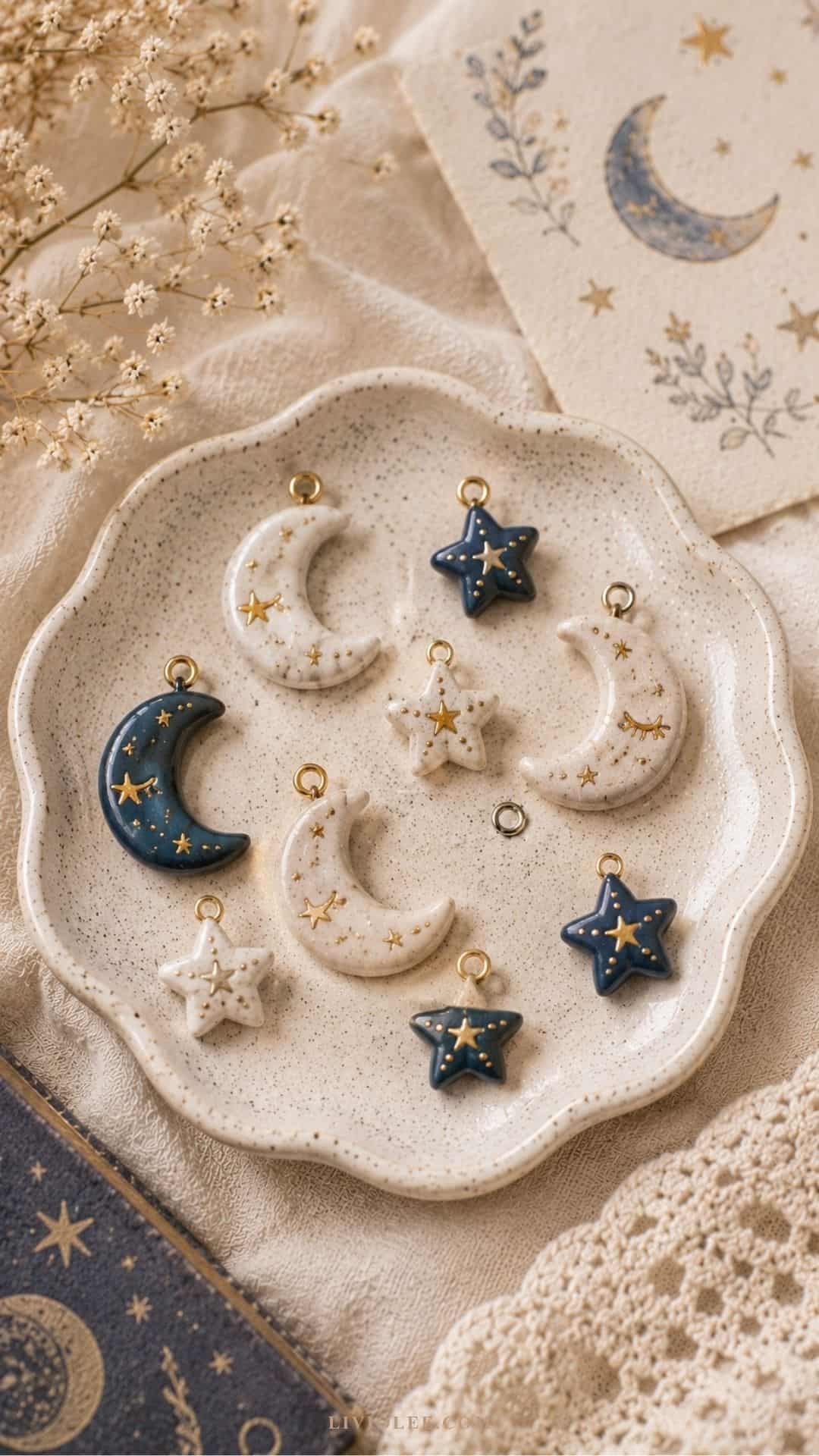 handmade air dry clay moon and star charms arranged in a speckled ceramic dish