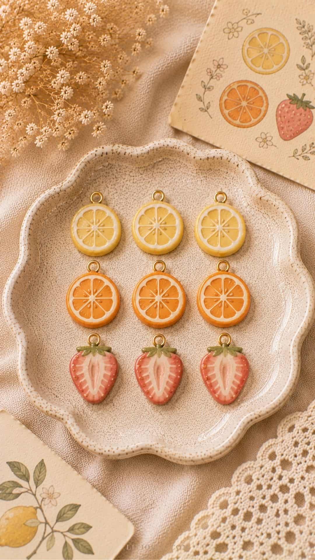 air dry clay fruit slice charms featuring lemons, oranges, and strawberries