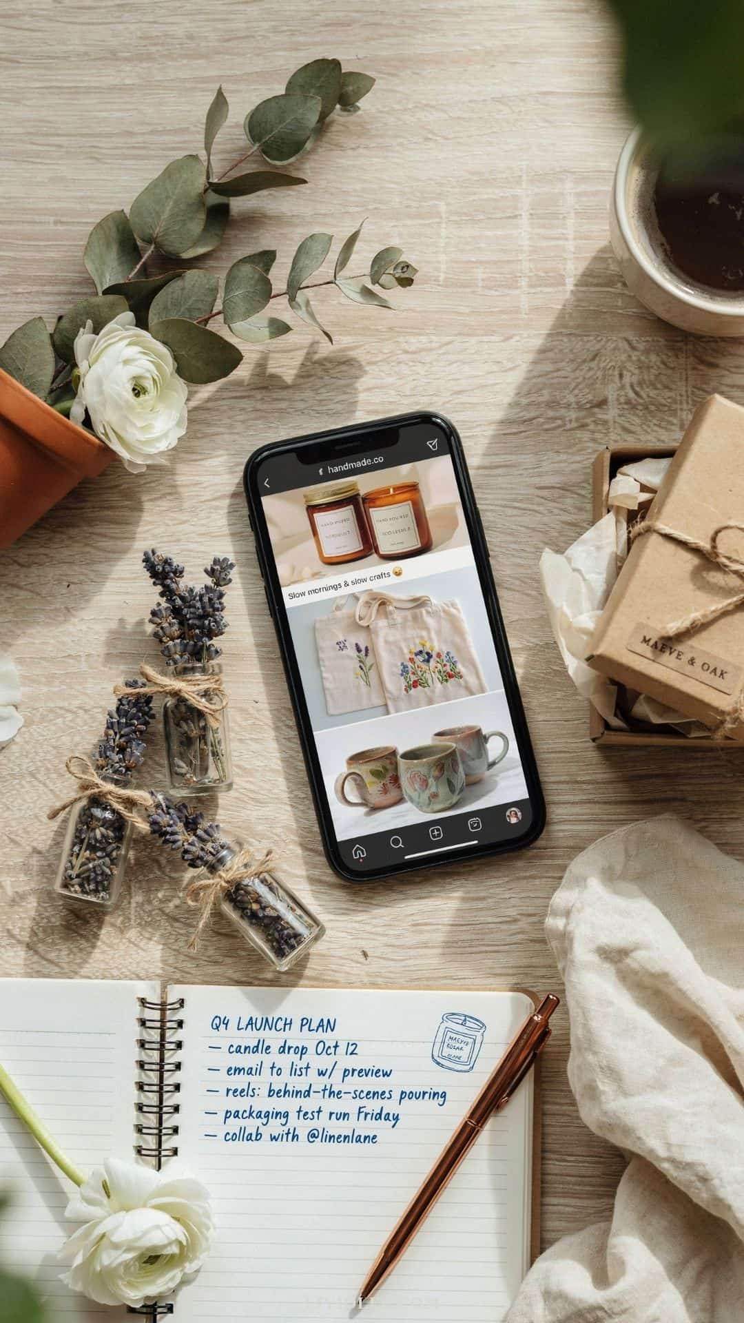 Handmade products packaged for shipping beside a laptop, kraft boxes, thank-you cards, and small business branding materials